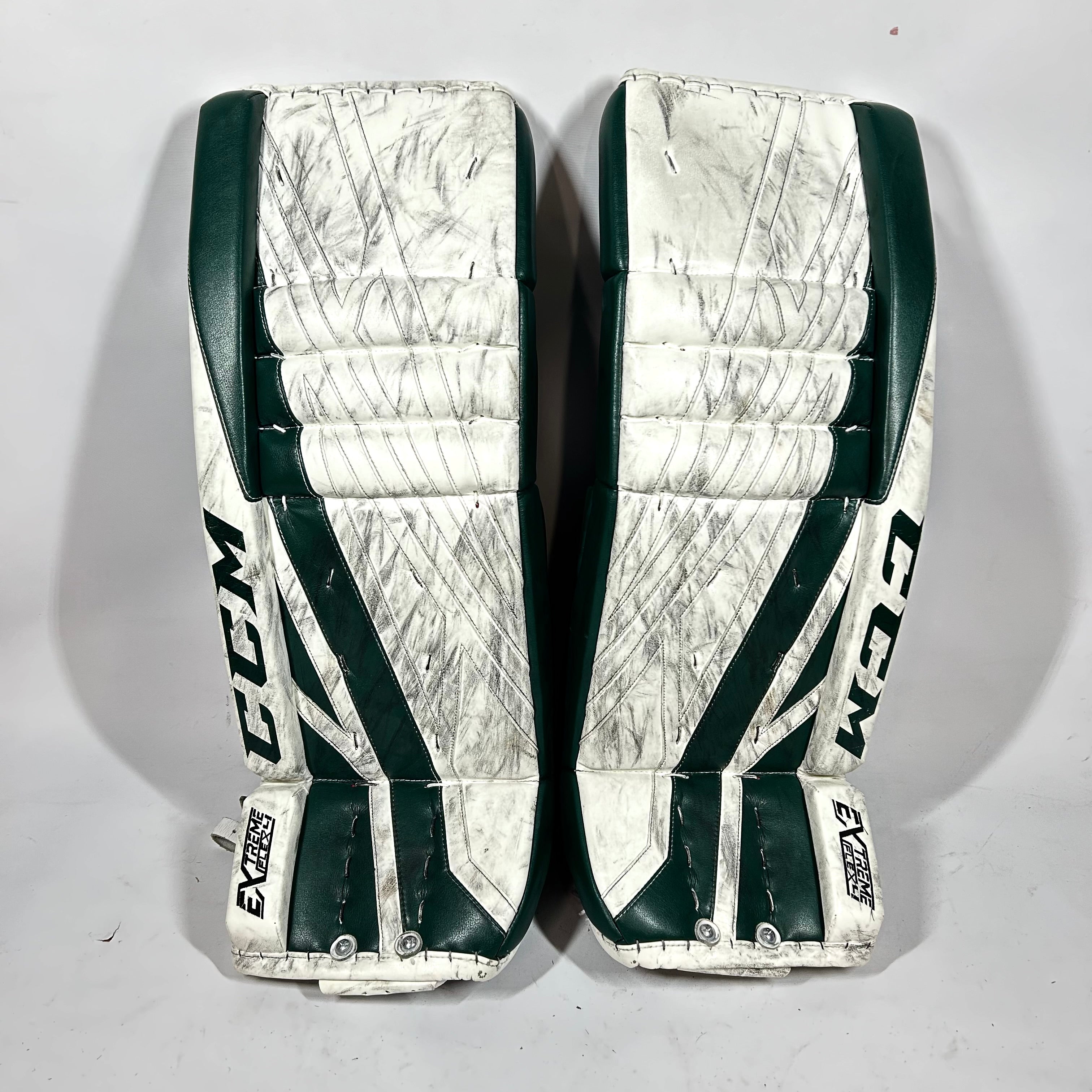 CCM Extreme Flex 4 - Jambières de gardien de but NCAA Pro Stock Senior d'occasion (blanches/vertes)